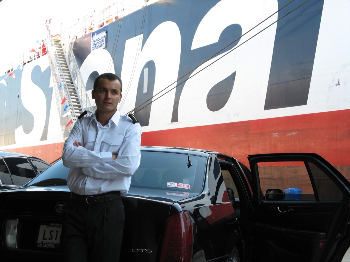 One of Roadstead's founders as a young ship's officer in uniform beside the product tanker Stena Performance at the Port of Charleston